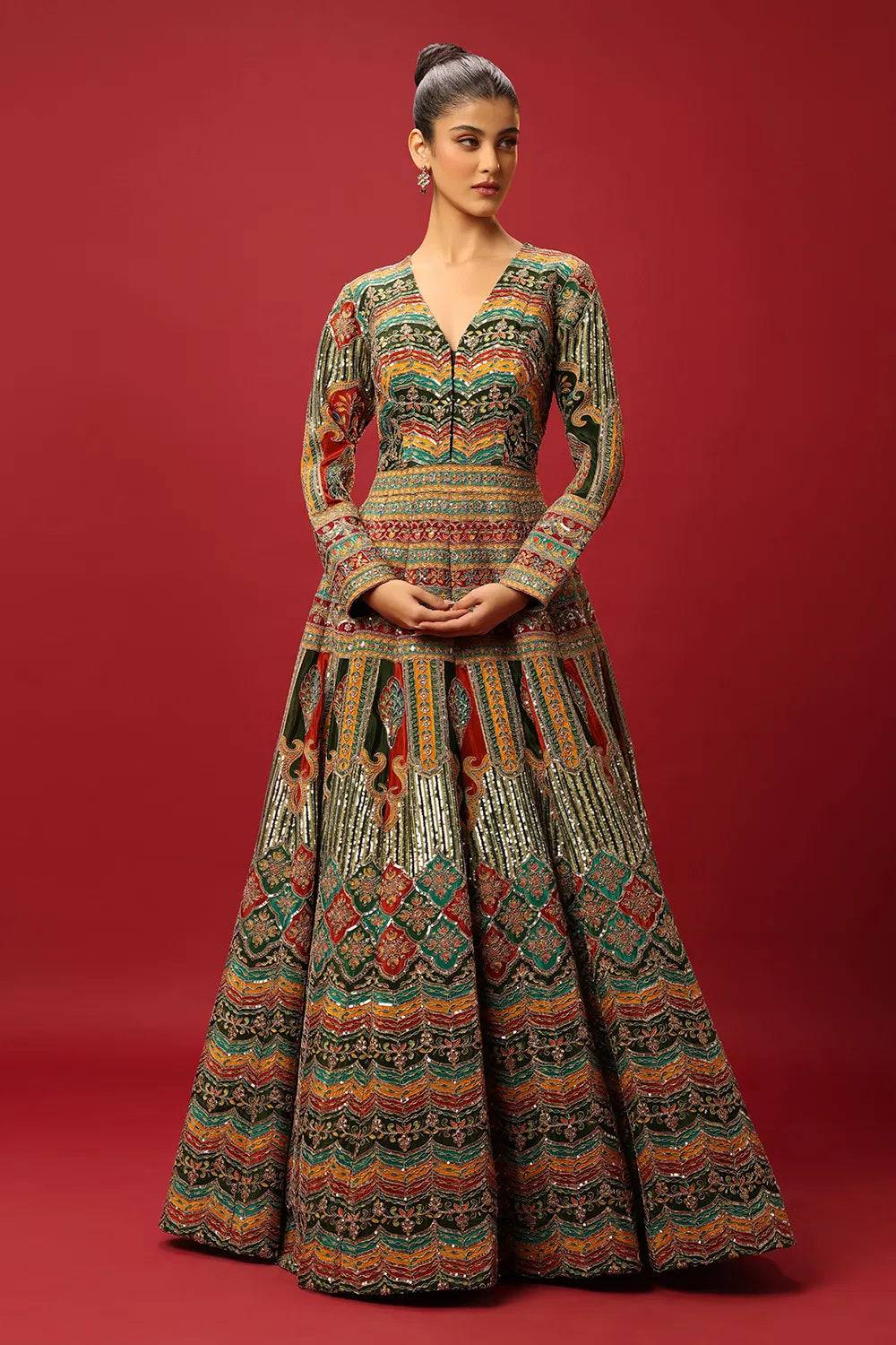 FERN GREEN AND RED CLASSIC MULTI COLOURED PRINTED ANARKALI GOWN SET WITH GOLD ZARI THREAD WORK PAIRED WITH A CONTRAST RED DUPATTA AND SEQUIN DETAILS.