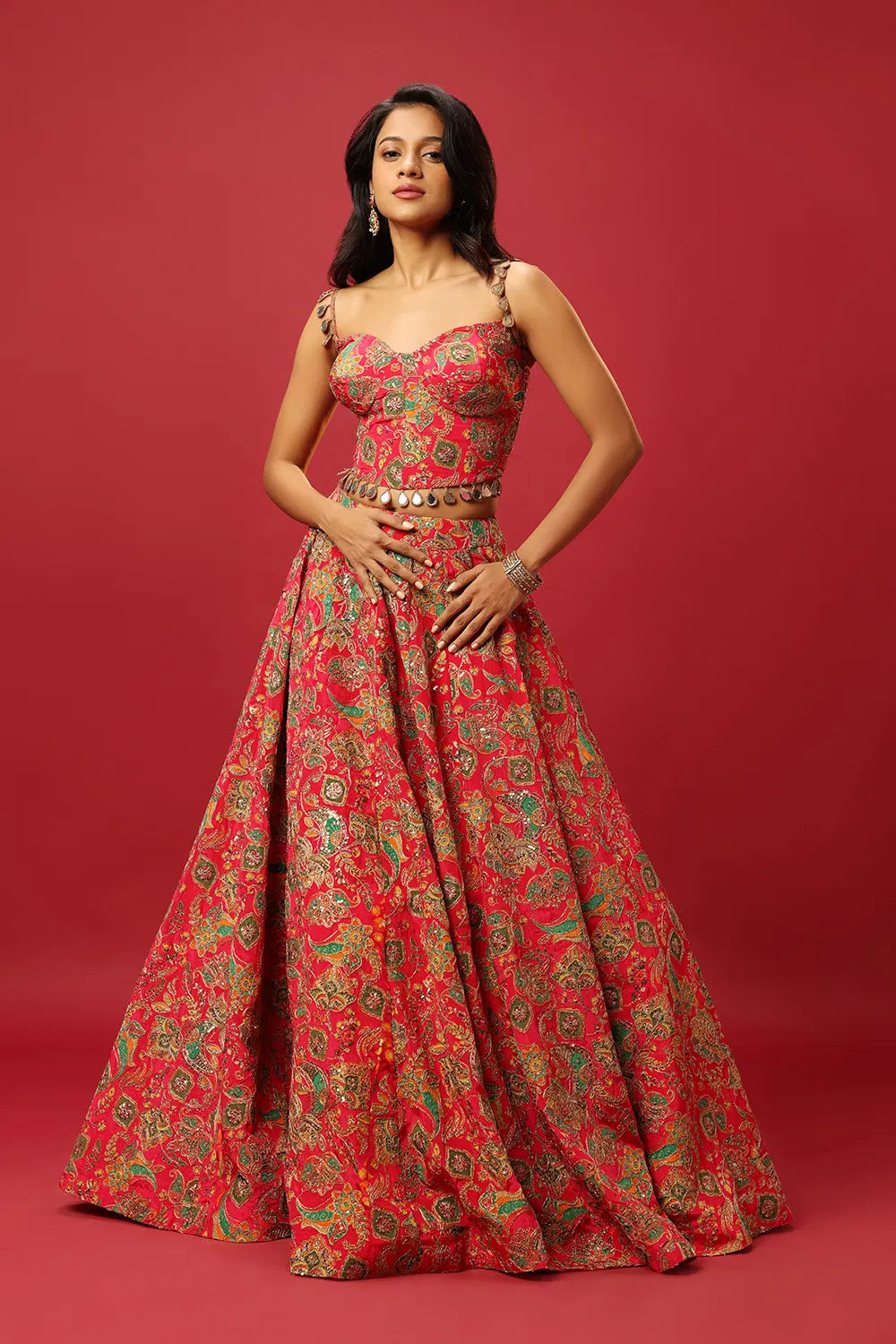 BRIGHT PINK CLASSIC MULTI COLOURED PRINTED LEHENGA SET WITH GOLD ZARI THREAD WORK PAIRED WITH A CONTRAST GREEN DUPATTA AND SEQUIN WORK EMBELLISHMENTS