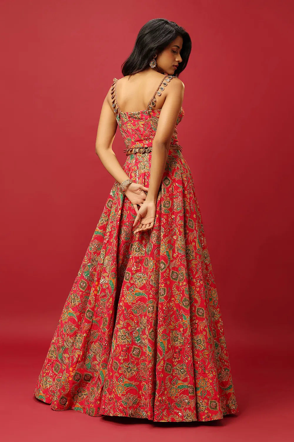 BRIGHT PINK CLASSIC MULTI COLOURED PRINTED LEHENGA SET WITH GOLD ZARI THREAD WORK PAIRED WITH A CONTRAST GREEN DUPATTA AND SEQUIN WORK EMBELLISHMENTS
