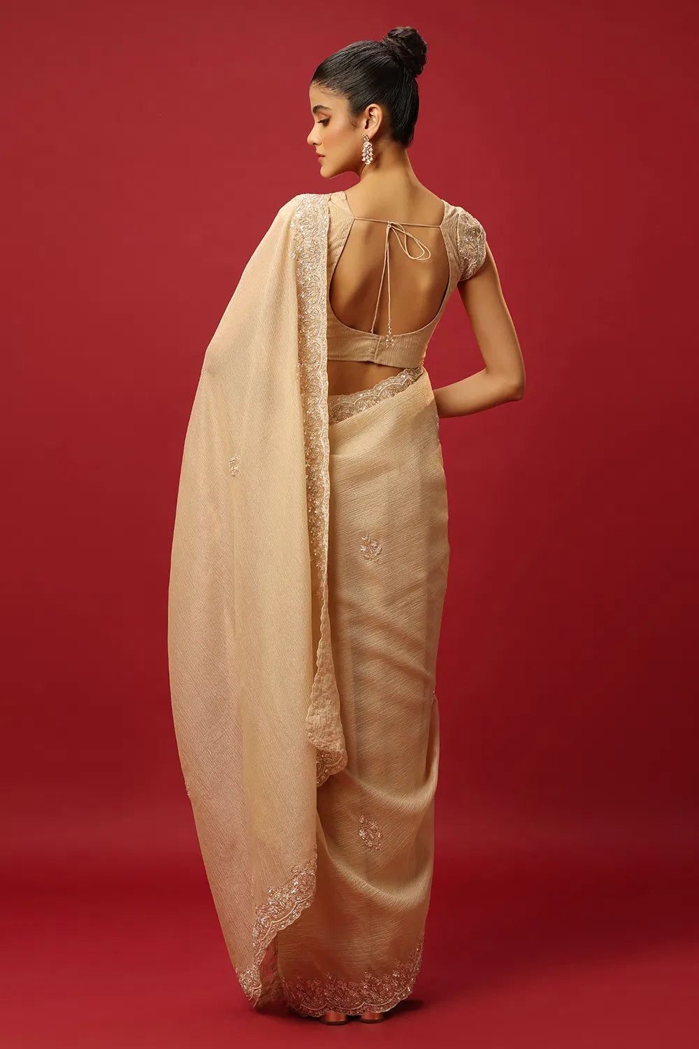 BEIGE GOLD WRINKLE TISSUE CLASSIC SAREE SET WITH A HAND EMBROIDERED FLORAL BORDER PAIRED WITH A MATCHING BLOUSE